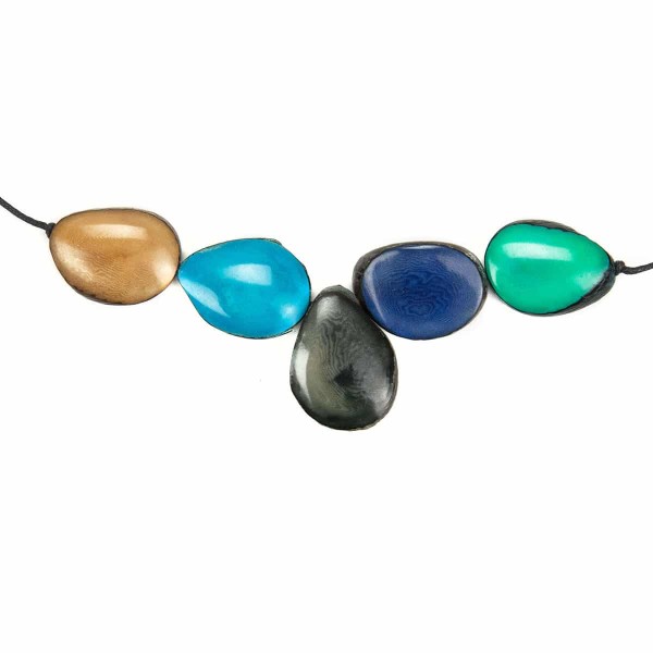 A picture of a coastal cinco tagua necklace.