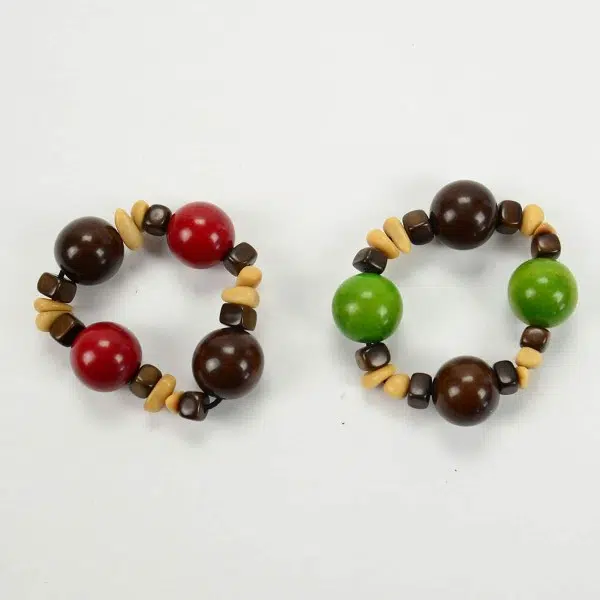 two gumball bracelets next to each other, one red and the other green.
