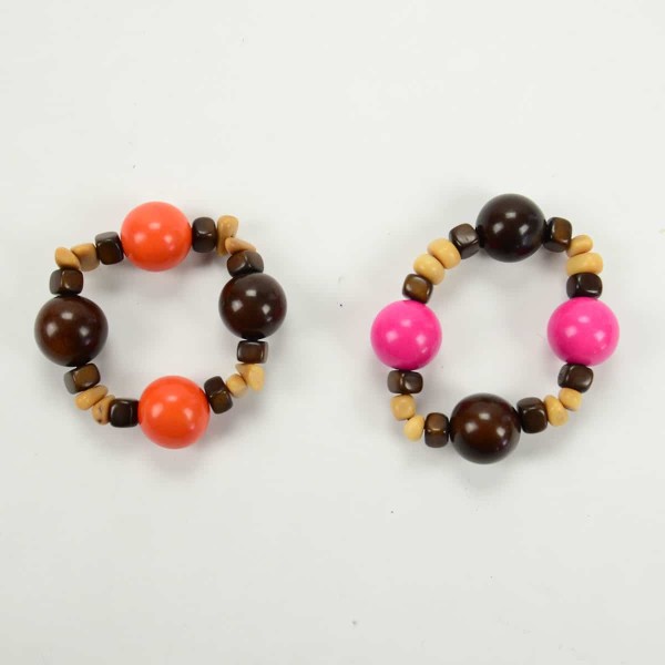 two gumball bracelets next to each other, one pink and the other orange.