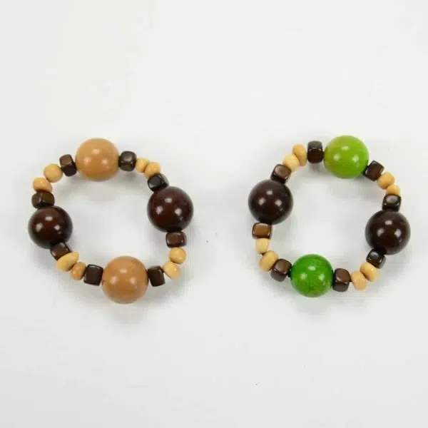 two gumball bracelets next to each other, one brown and the other green.