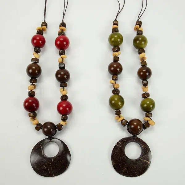 A picture of two necklaces, they have tagua balls that look like gum-balls, they come in a verity of colors, the two colors in this picture are red and green.