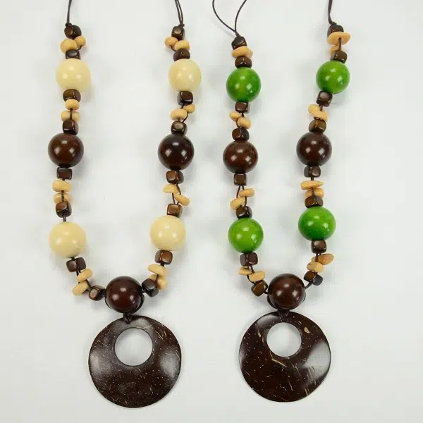 A picture of two necklaces, they have tagua balls that look like gum-balls, they come in a verity of colors, the two colors in this picture are white, and green.