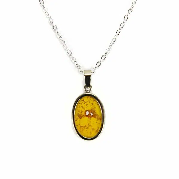 A close up picture of the yellow butterfly necklace.