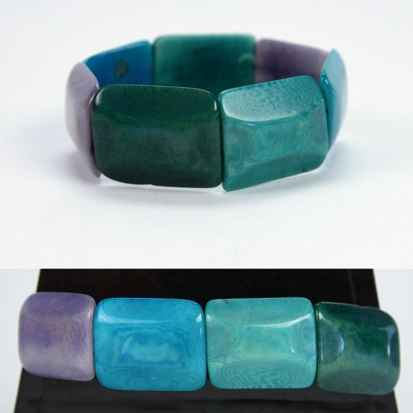 Square tagua pieces put together to create a bracelet, coming in a verity of colors, this color is turquoise, purple, blue, and dark turquoise.