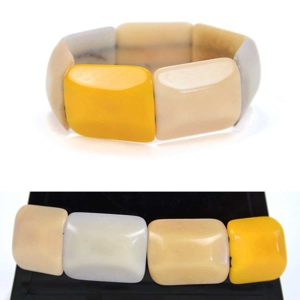 Square tagua pieces put together to create a bracelet, coming in a verity of colors, this color is green, yellow, white, and tan