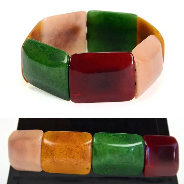 Square tagua pieces put together to create a bracelet, coming in a verity of colors, this color is green, red, yellow, and white.