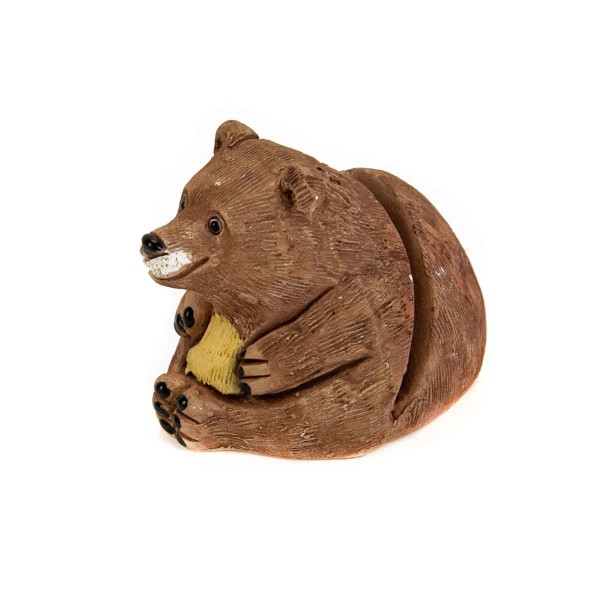 A ceramic card holder that looks like a bear.