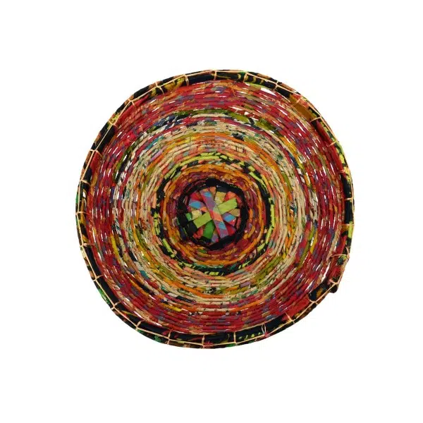 A top down picture of the round sari basket, made from bamboo wrapped in recycled cotton