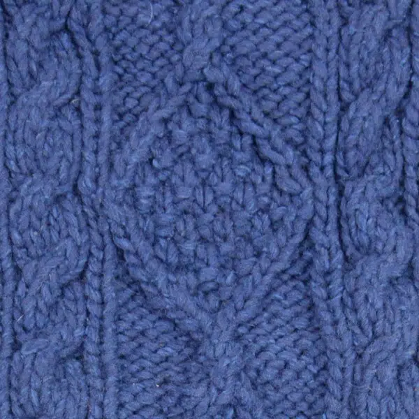close up of the hand knit wool hat material, the color of this material is blue