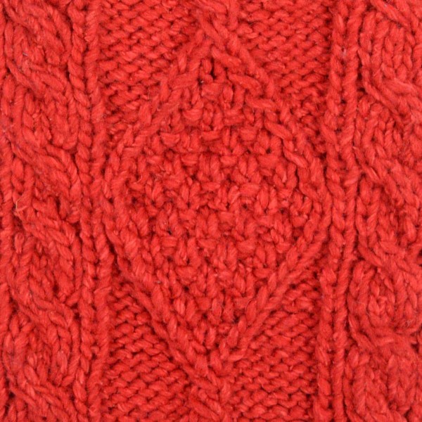 close up of the hand knit wool hat material, the color of this material is red