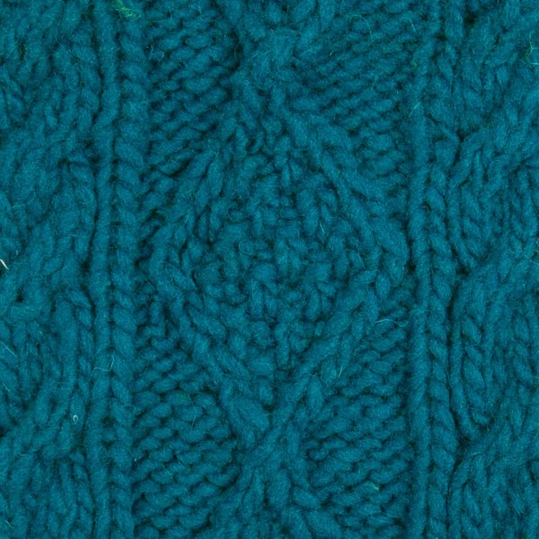 close up of the hand knit wool hat material, the color of this material is dark blue
