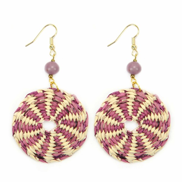 A close up picture of the disco straw earrings, comes in a verity of colors, this colors is pink and white.