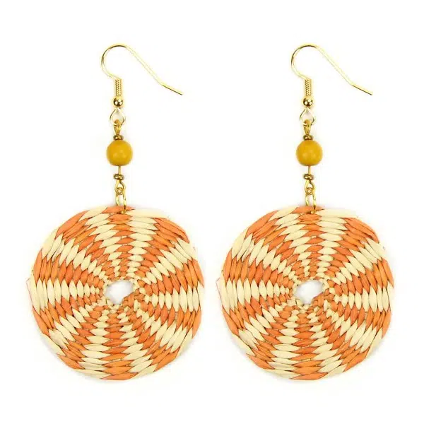 A close up picture of the disco straw earrings, comes in a verity of colors, this colors is orange and white.