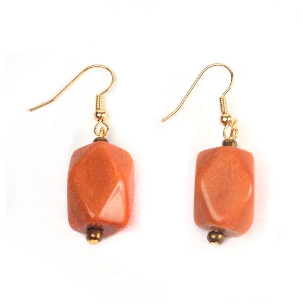 A close up of the orange facet earrings