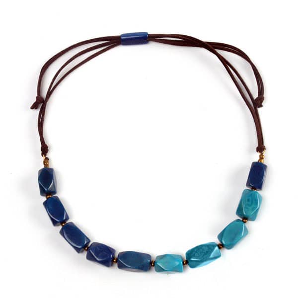 A close up picture of the blue/ turquoise facet necklace.