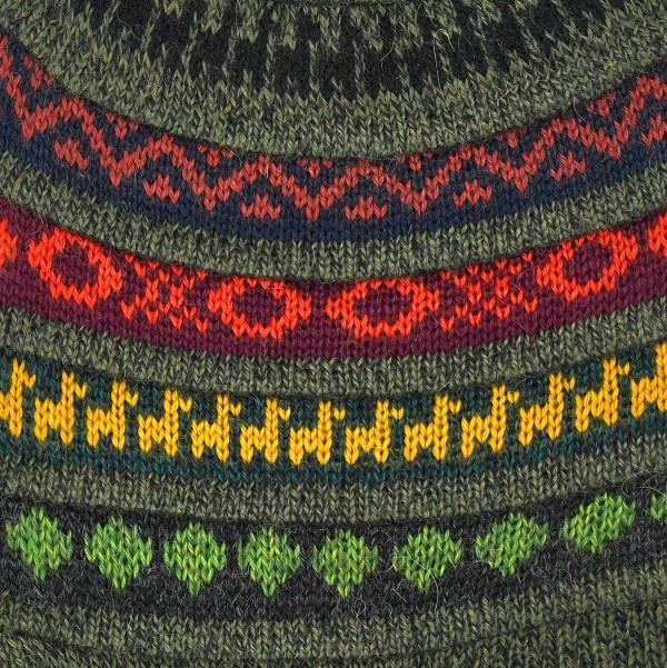 Close up of the dark green hat, showing the lightly colored designs