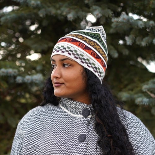 Young women wearing a white hat with brightly colored designs