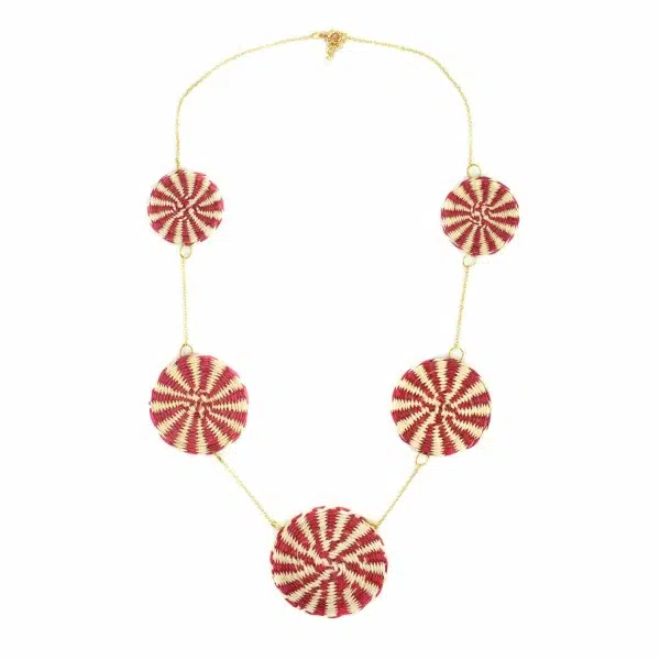 Woven straw circles added on a chain to make this necklace, the straw circles come in a verity of colors. The color in this picture is red.