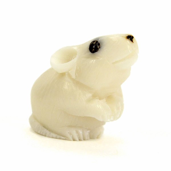 A mini tagua critter of a rabbit sitting