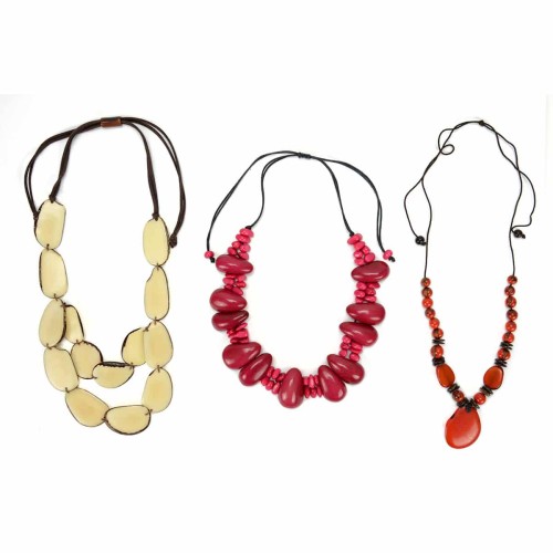 A picture of three necklaces made from tagua.