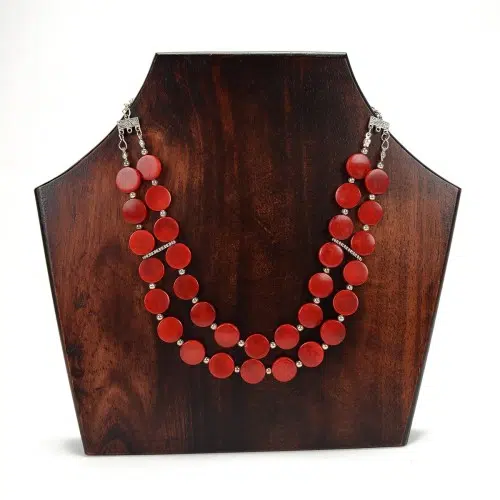The deco necklace is made out of tagua seeds that have been dyed. the color that this necklace is red.