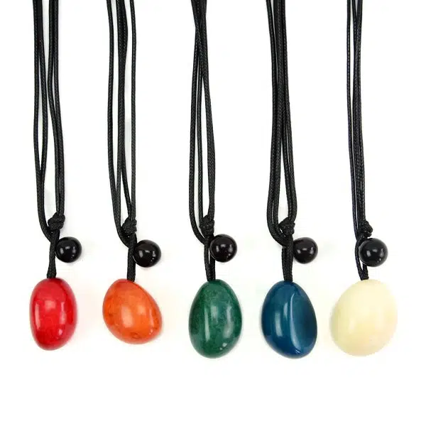 A picture of five different tagua big seed necklace, the colors in this picture are red, orange, green, blue, white.