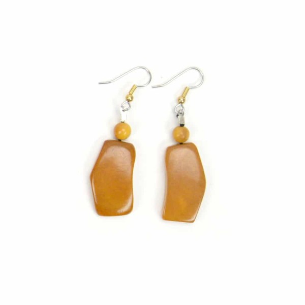 A hand carved and dyed tagua piece, the pieces come in a verity of colors, the color in this picture is yellow.