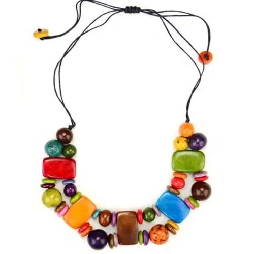 A picture of a multi colored plaque necklace, made from a combination of tagua beads.