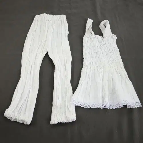 bundle of two white pants and white dress