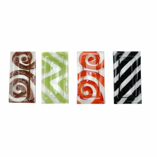 four different dishes that have designs on them all in different colors.