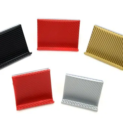 A picture of phone and tablet stands, they comes in colors of, red, black, white, and gold