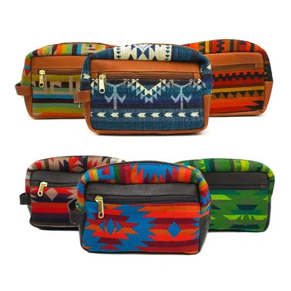Small leather dopp kit bags in tan and dark brown, with tribal patterns