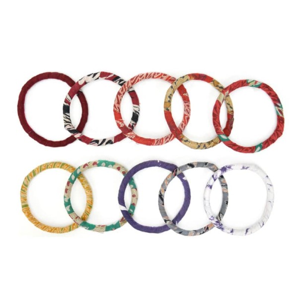 A top down picture of the adult bangle bundles, these bracelets come in a bunch of different reds and yellow, blue, purple, grey and white.