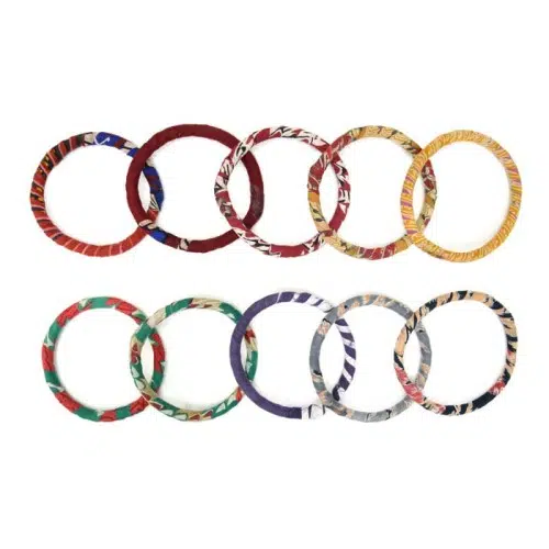 A top down picture of the adult bangle bundles, coming in a bunch of different colors, reds, yellow, blue, purple, grey, and black.