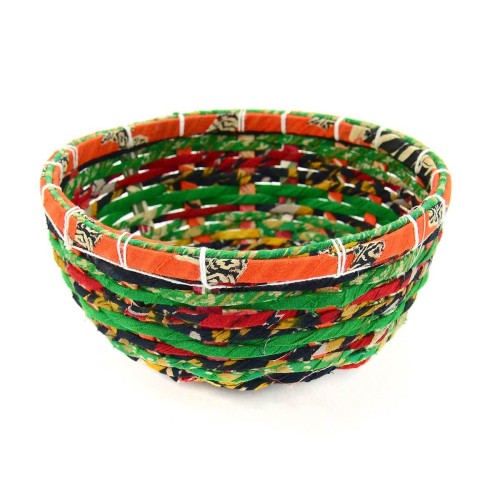 A bright and colorful basket made from cotton and hand woven grass basket
