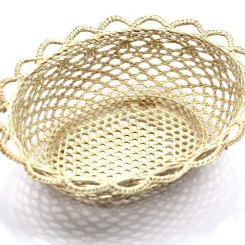 A close up of the straw panera basket, meant for holding fruit or bread