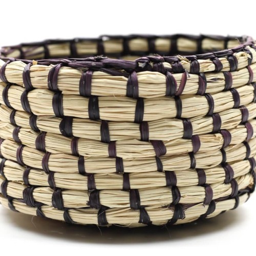 A close up picture of the small straw basket that has been hand woven