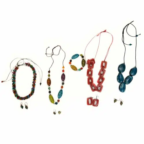 A picture of a wide variety of necklaces and earrings.