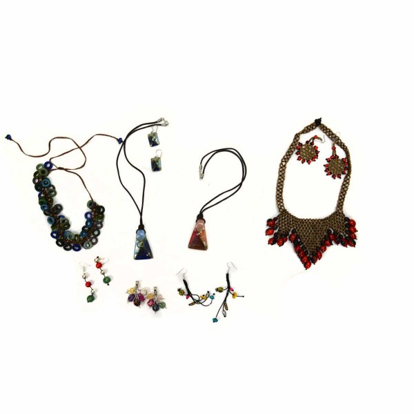 A picture of a wide verity of necklaces and earrings.