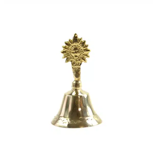 A radiant brass bell adorned with a sun motif, captured against a clean white backdrop.